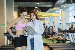 Woman talking to her sports medicine physician