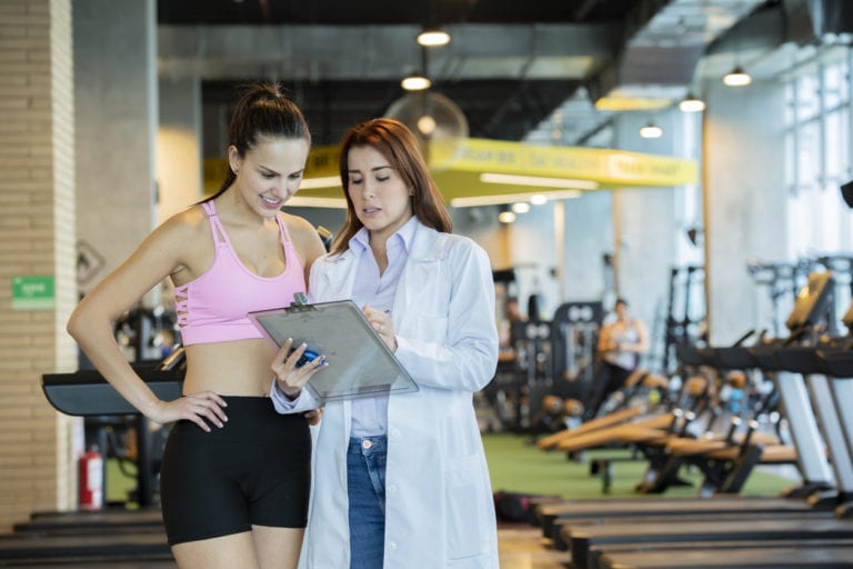 Woman talking to her sports medicine physician