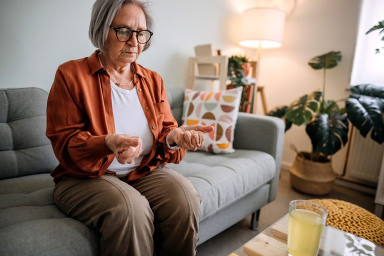 Senior woman suffering from wrist pain