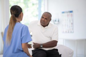 Elderly man with hip arthritis pain