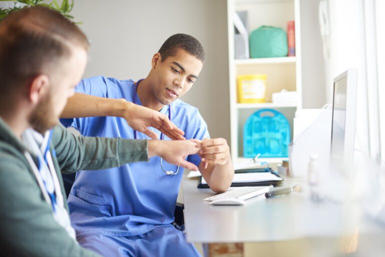 Doctor Examining patients wrist