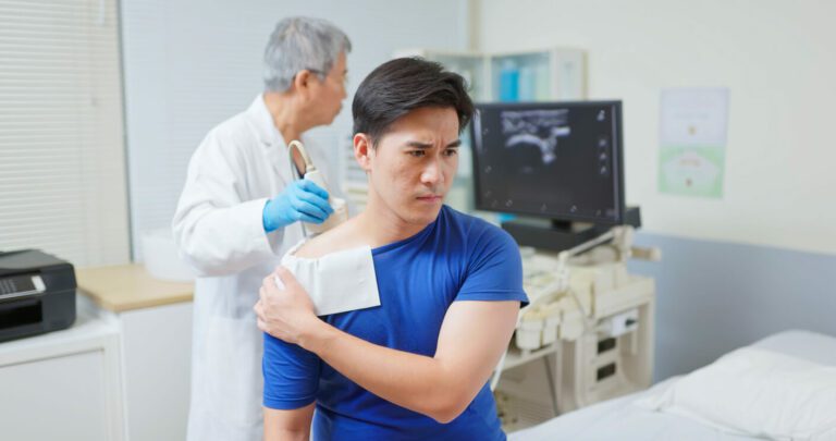 man with shoulder injury getting an ultrasound