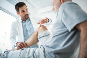 Doctor examining a patient's knee