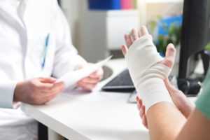 Patient with their wrist sprain wrapped