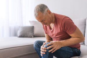 Older man with knee pain