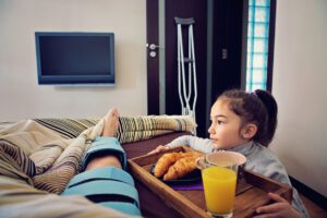 Patient on on bed after ACL repair surgery